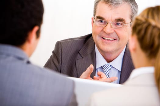 Image of senior leader communicating with his workers