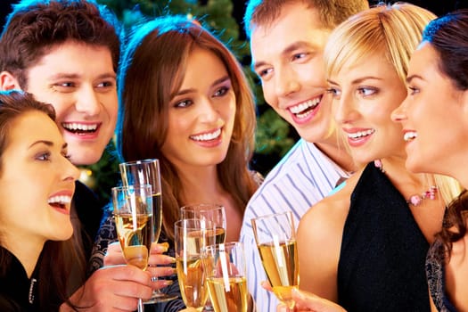 Photo of people clinking by glasses with each other