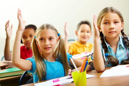 Image of pupils raising arms during the lesson