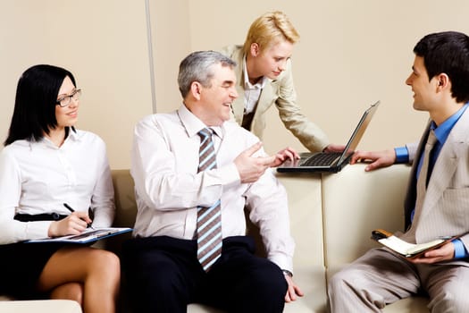 Portrait of business partners communicating in office