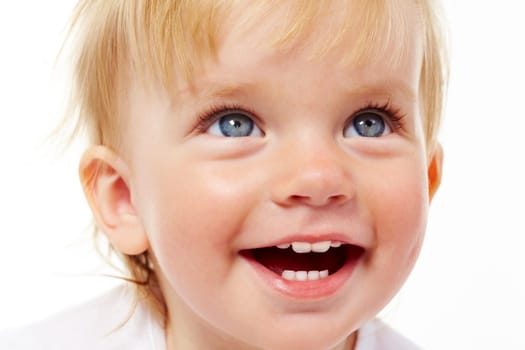Portrait of cute child laughing in isolation