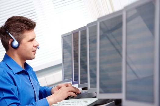 Image of telephone operator working in the computer class