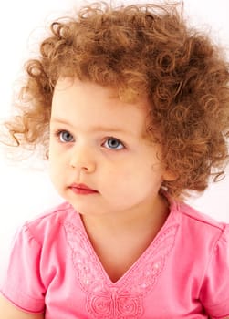 Portrait of small girl looking aside with serene expression