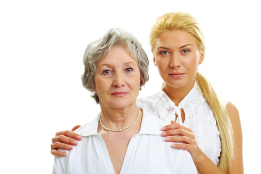 Portrait of attractive woman touching her old mother