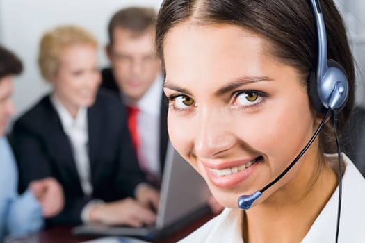 Portrait of friendly smiling business woman with headset