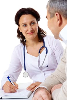 Portrait of friendly therapist looking at senior patient during medical consultation