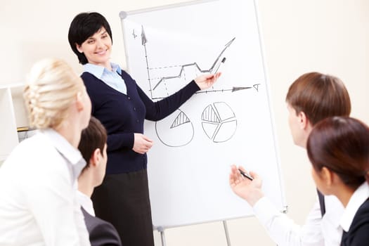 Image of confident woman making presentation and interacting with the audience