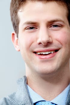 Face of young handsome businessman looking at camera