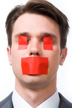 Photo of man with red stickers on his eyes and mouth