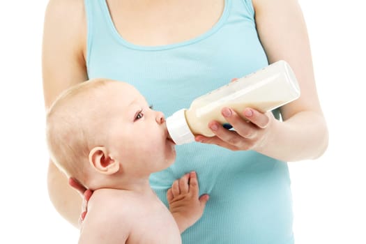Image of adorable baby drinking milk from bottle in mother hands