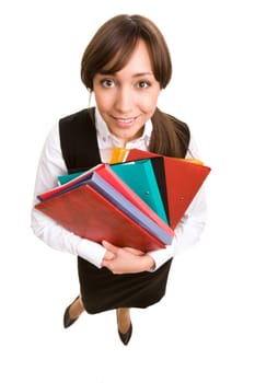 Below angle of pretty girl with stack of folders looking at camera