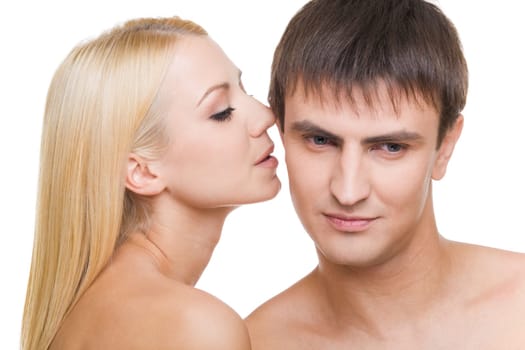 Luxurious woman whispering something to her sweetheart on white background