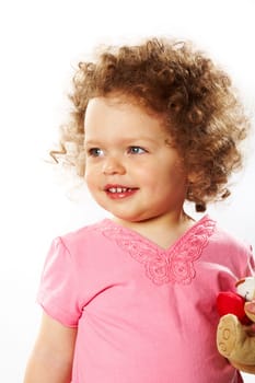 Portrait of small girl looking aside with smile over white background