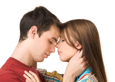 Portrait of amorous dates standing face to face and embracing each other