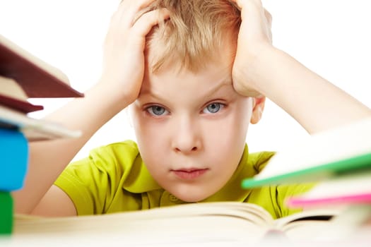 Portrait of a little boy among books