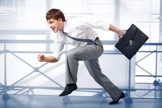 Image of a businessman racing in office building