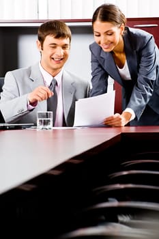 Portrait of business man and woman working together in the boardroom