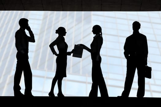 Four outlines of business partners with interacting females in the middle