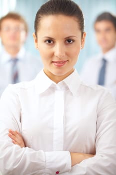 Portrait of a serious businesswoman standing with her hands crossed