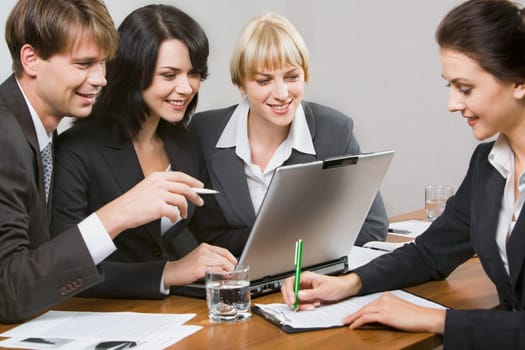 Contemporary business people working together in the office