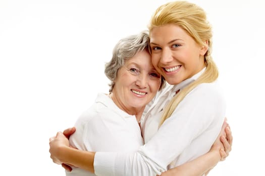 Portrait of attractive girl and senior woman embracing each other