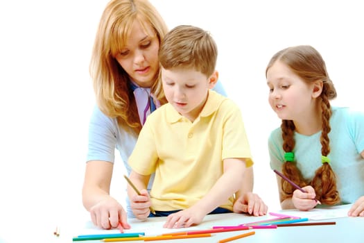 Photo of cute preschoolers and their mother drawing