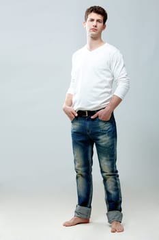 Portrait of young handsome guy wearing stylish clothes in isolation