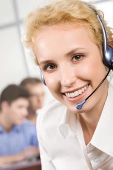 Portrait of nice smiling consultant with headset
