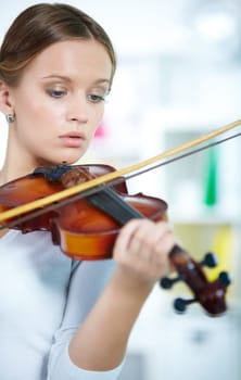 Portrait of a young female playing the violin
