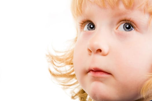 Photo of adorable child with grey eyes looking aside