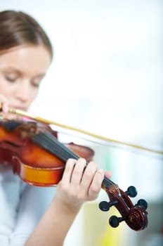 Close-up of a young female playing the violin