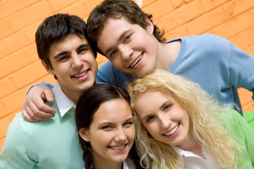 Portrait of friendly students looking at camera with happy smiles