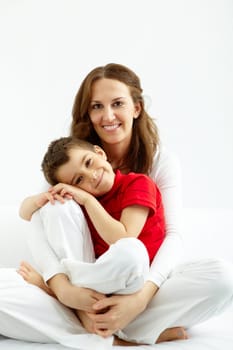 Cute lad and his mother having good time at home