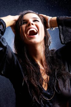 Portrait of glad girl in black tanktop getting wet in rain
