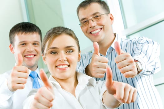 Image of business people showing sign of okay