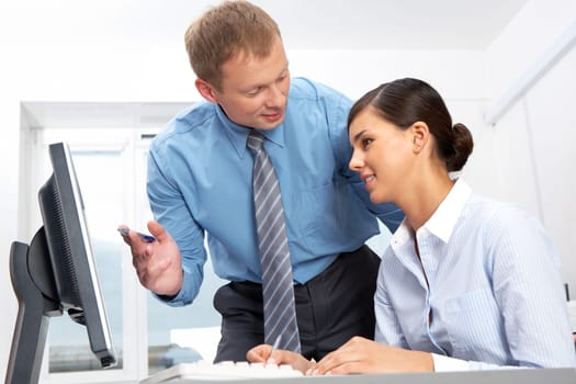 Manager giving opinion to his secretary