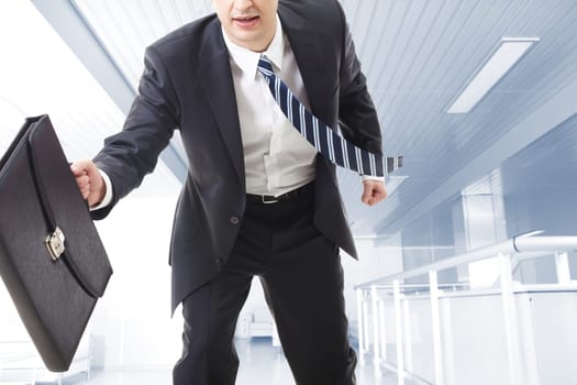 Close-up of running businessman