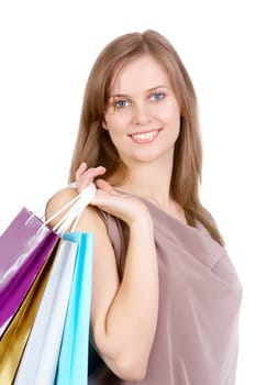 Portrait of a beautiful woman with shopping bags looking at camera and smiling