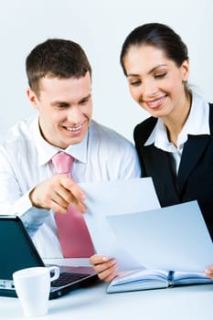 Portrait of confident business people working with documents  together
