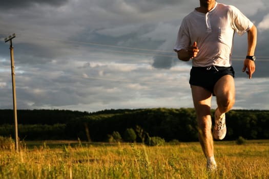 Close-up of man doing exercise at autumn