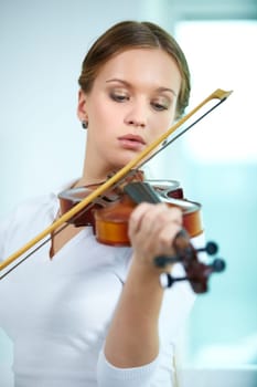 Portrait of a young female playing the violin