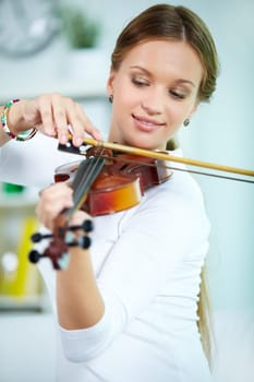 Portrait of a young female playing the violin