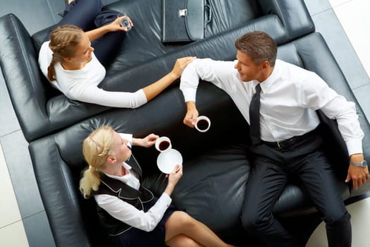 Image of company of successful partners interacting at meeting