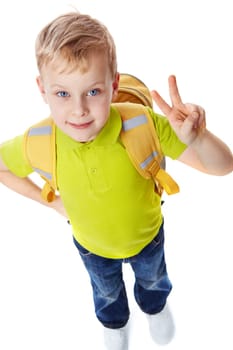 Portrait of a little boy with bag showing victory symbol