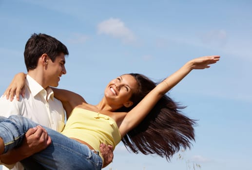 Image of handsome man and beautiful girl enjoying summer together