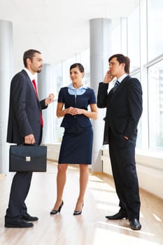 Photo of confident businessteam planning work or consulting each other