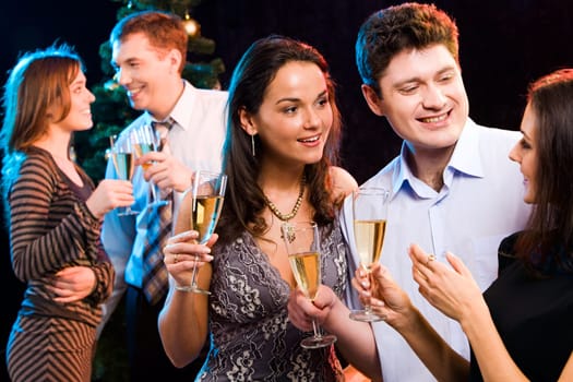 Portrait of smiling people interacting each other at a party