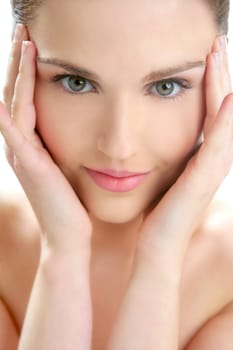 Portrait of young beautiful woman with clean skin at studio