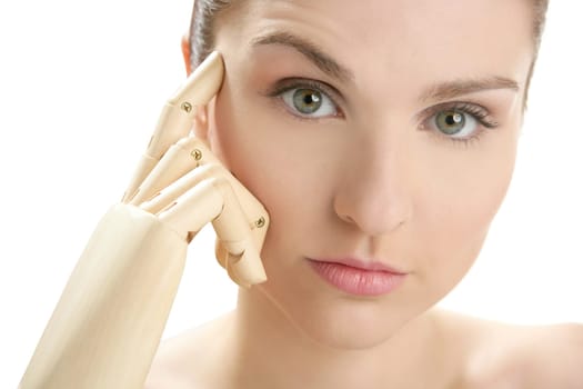 Funny woman cosmetic portrait, thinking with mannequin wooden hand