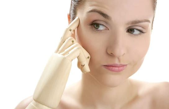Funny woman cosmetic portrait, thinking with mannequin wooden hand